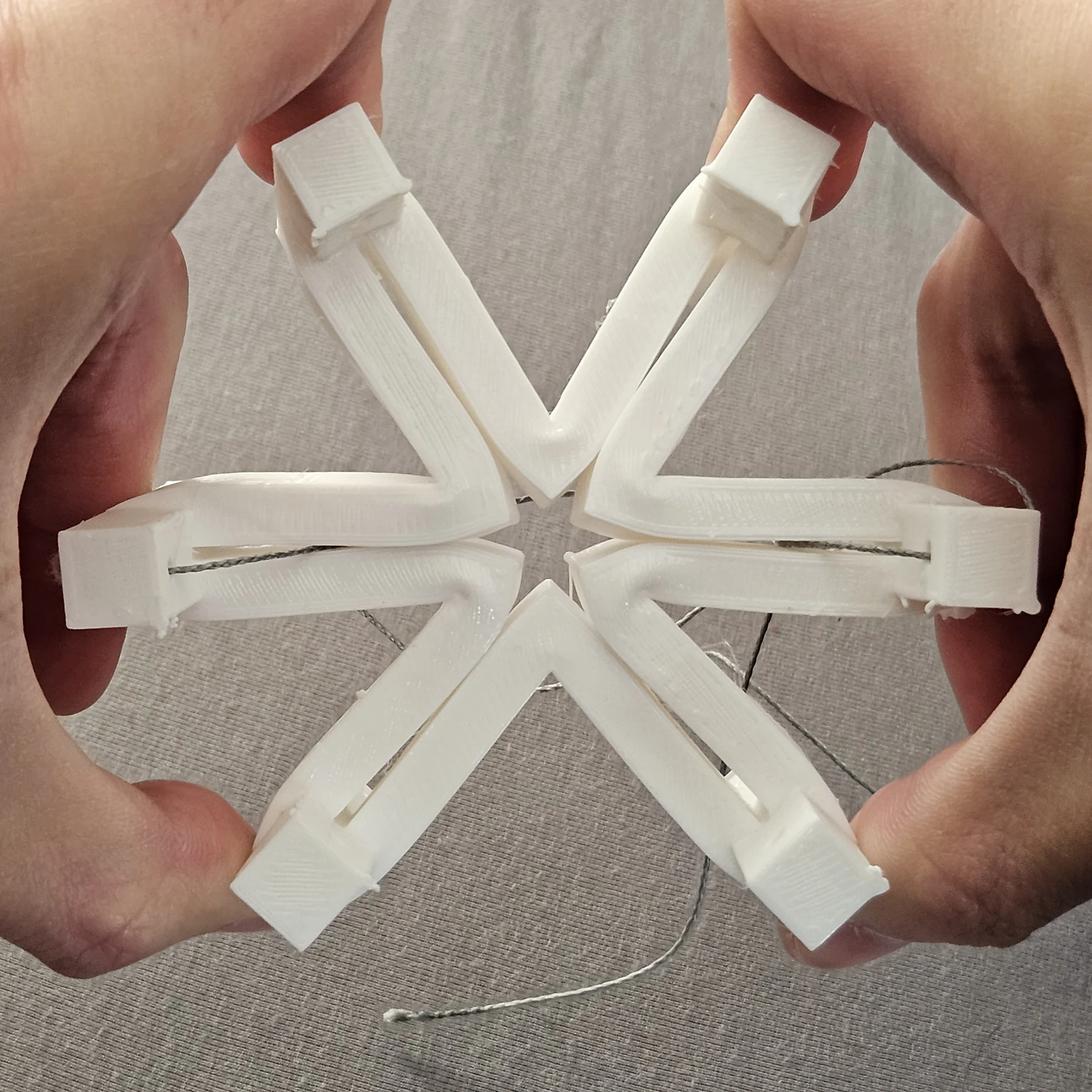Early printed star with cords running through its arms