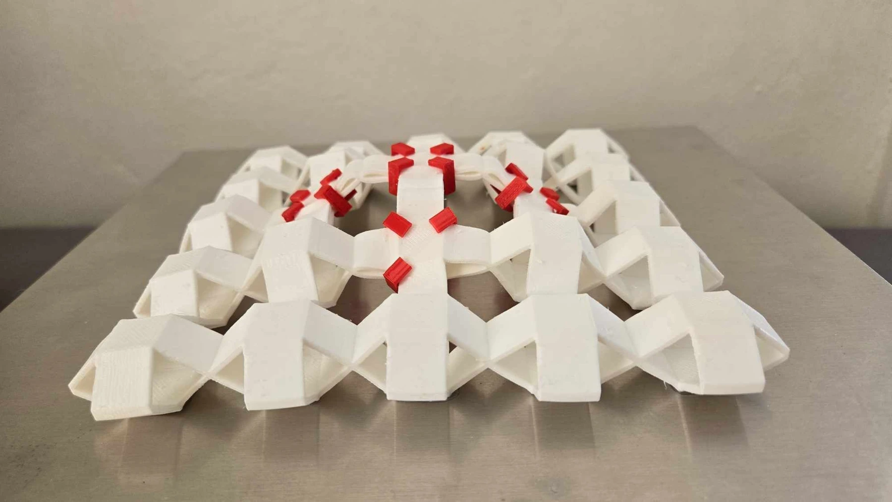 A raised Sarrus array with selected cells held by red pins